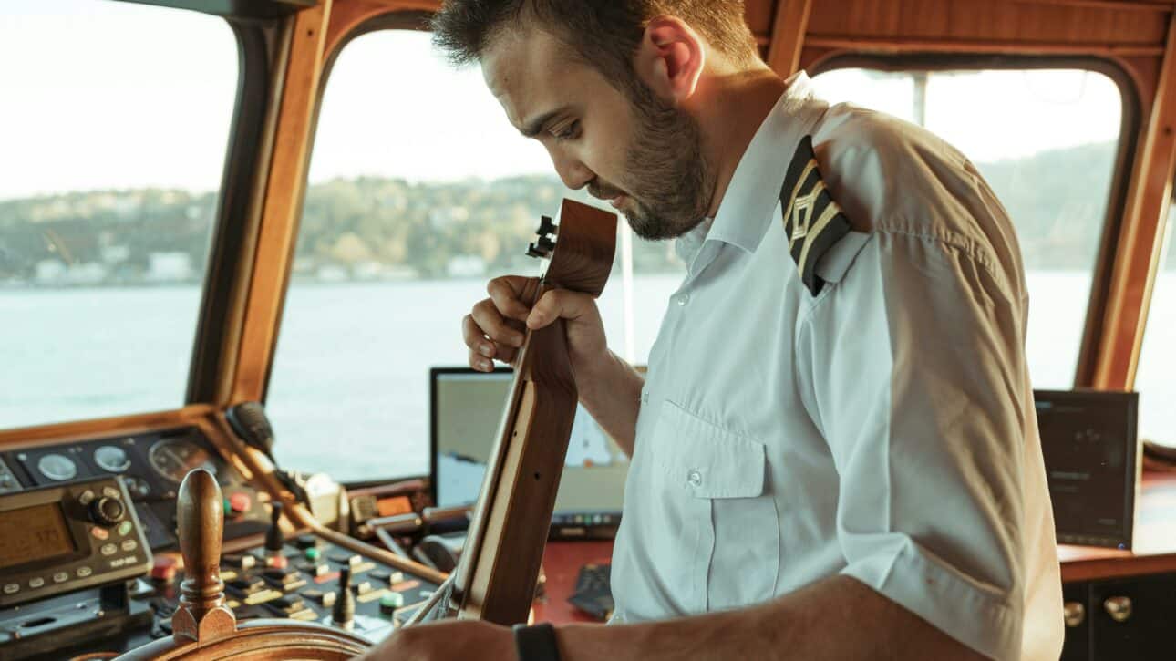 Yacht crew playing instrument