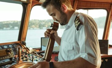 Yacht crew playing instrument