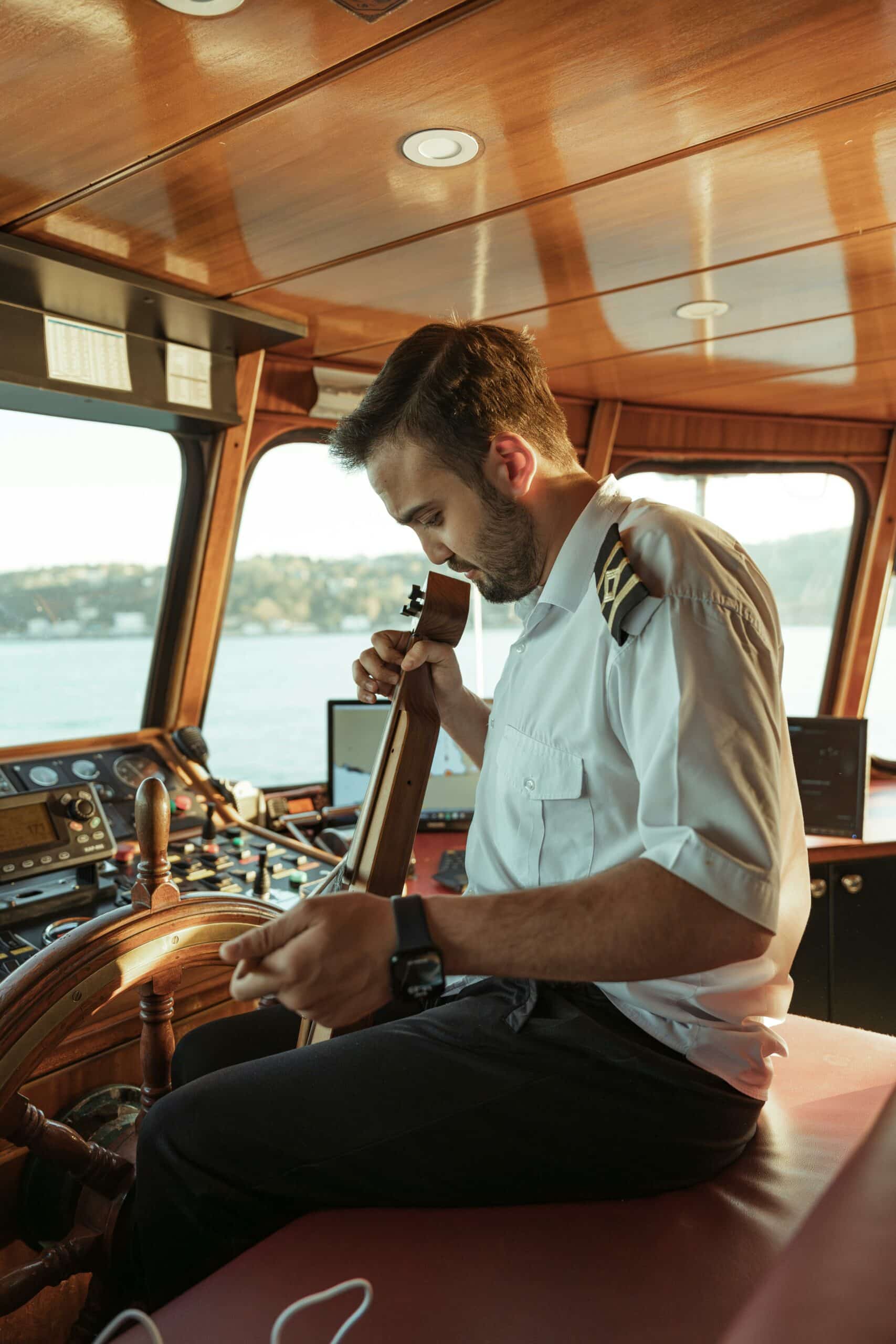 Yacht crew playing instrument